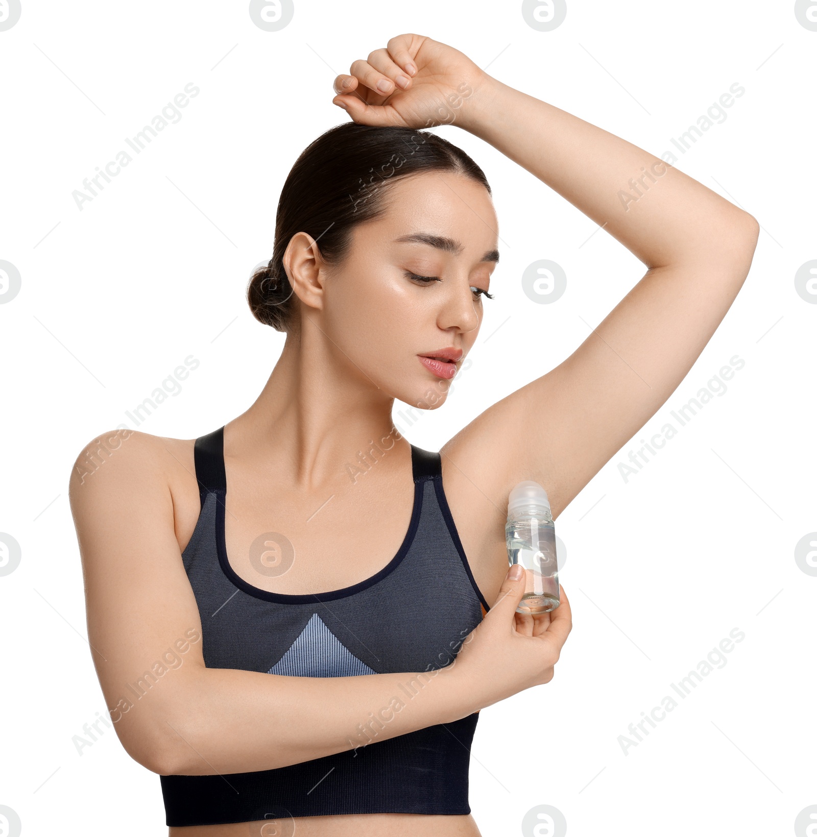 Photo of Beautiful woman applying deodorant on white background