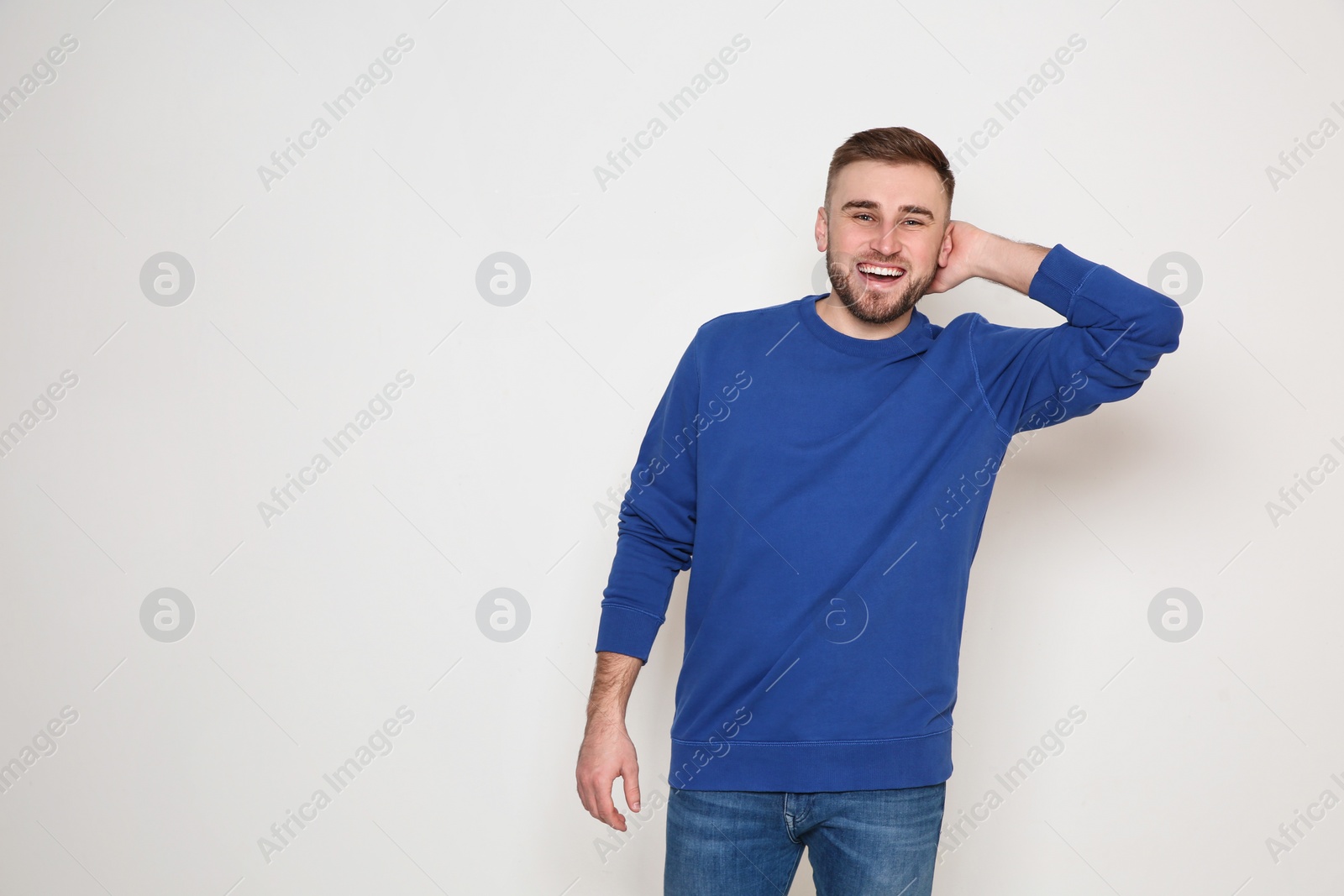 Photo of Portrait of handsome man posing on white background