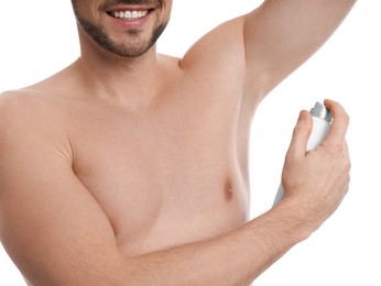 Man applying deodorant isolated on white, closeup