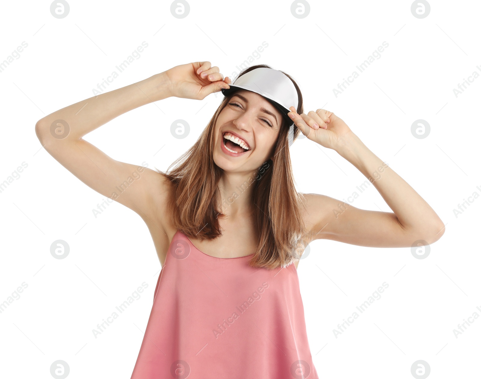 Photo of Beautiful woman wearing pajamas and sleep mask on white background. Bedtime