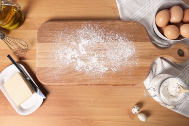 Photo of Many different ingredients for dough on wooden table, flat lay