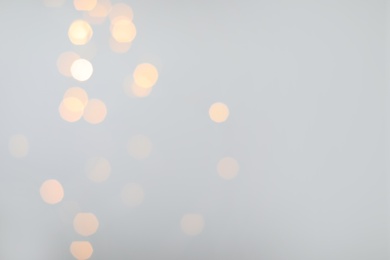 Photo of Blurred view of beautiful lights, space for text. Bokeh effect