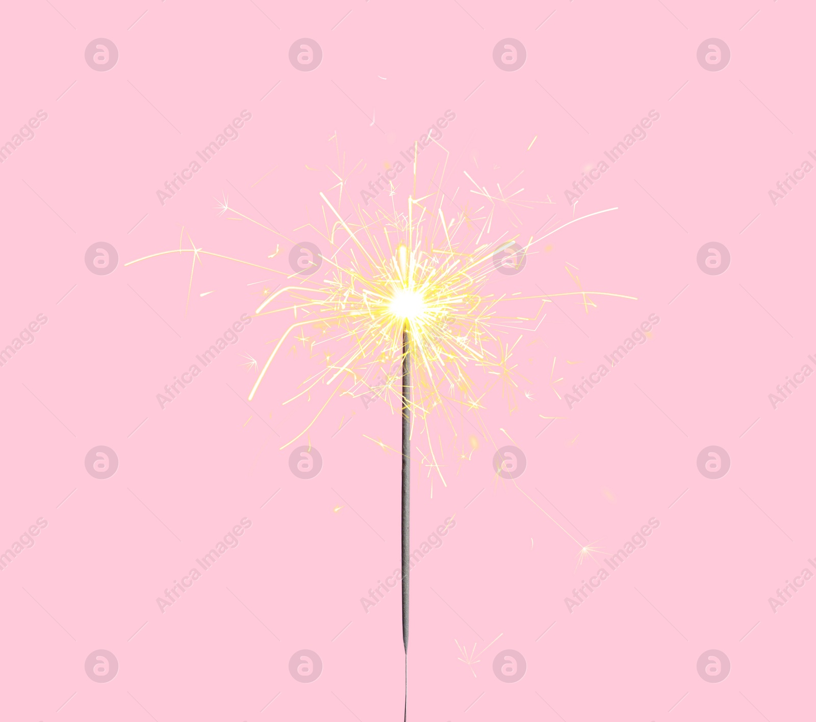 Image of Beautiful sparkler burning on pink background. Party decor