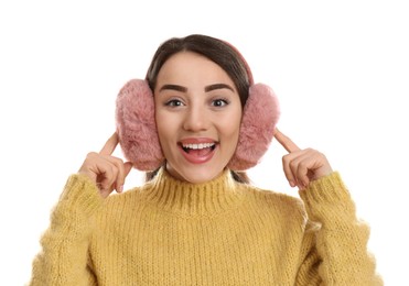 Photo of Beautiful young woman wearing earmuffs on white background