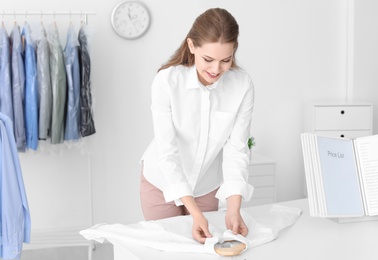 Employee working at dry-cleaner's