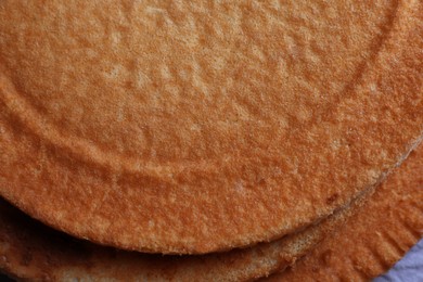 Photo of Delicious homemade sponge cakes as background, top view