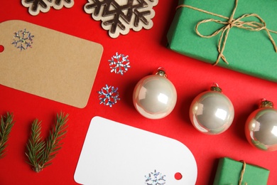 Photo of Flat lay composition with Christmas decor on red background