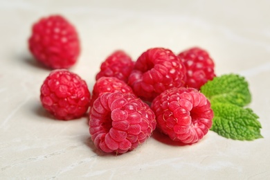 Photo of Ripe aromatic raspberries on table, closeup