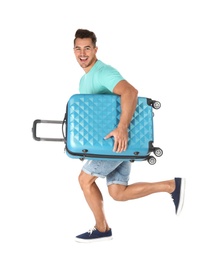 Photo of Young man running with suitcase on white background