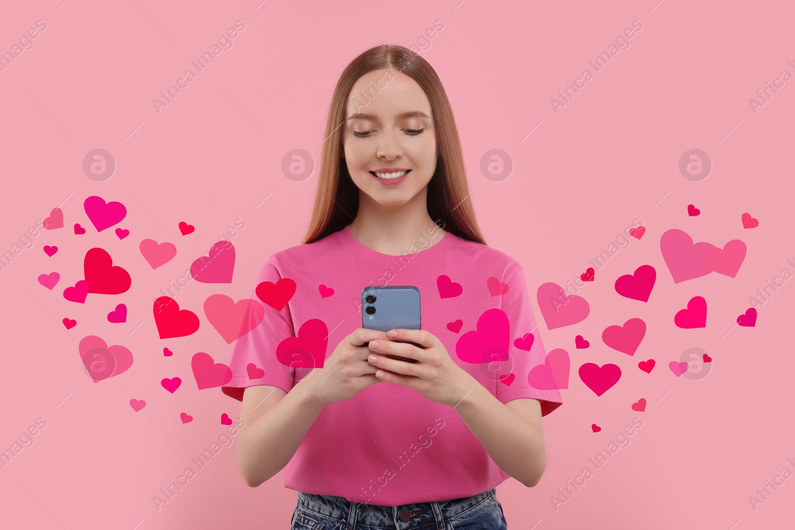 Image of Long distance love. Woman chatting with sweetheart via smartphone on pink background. Hearts flying out of device and swirling around her