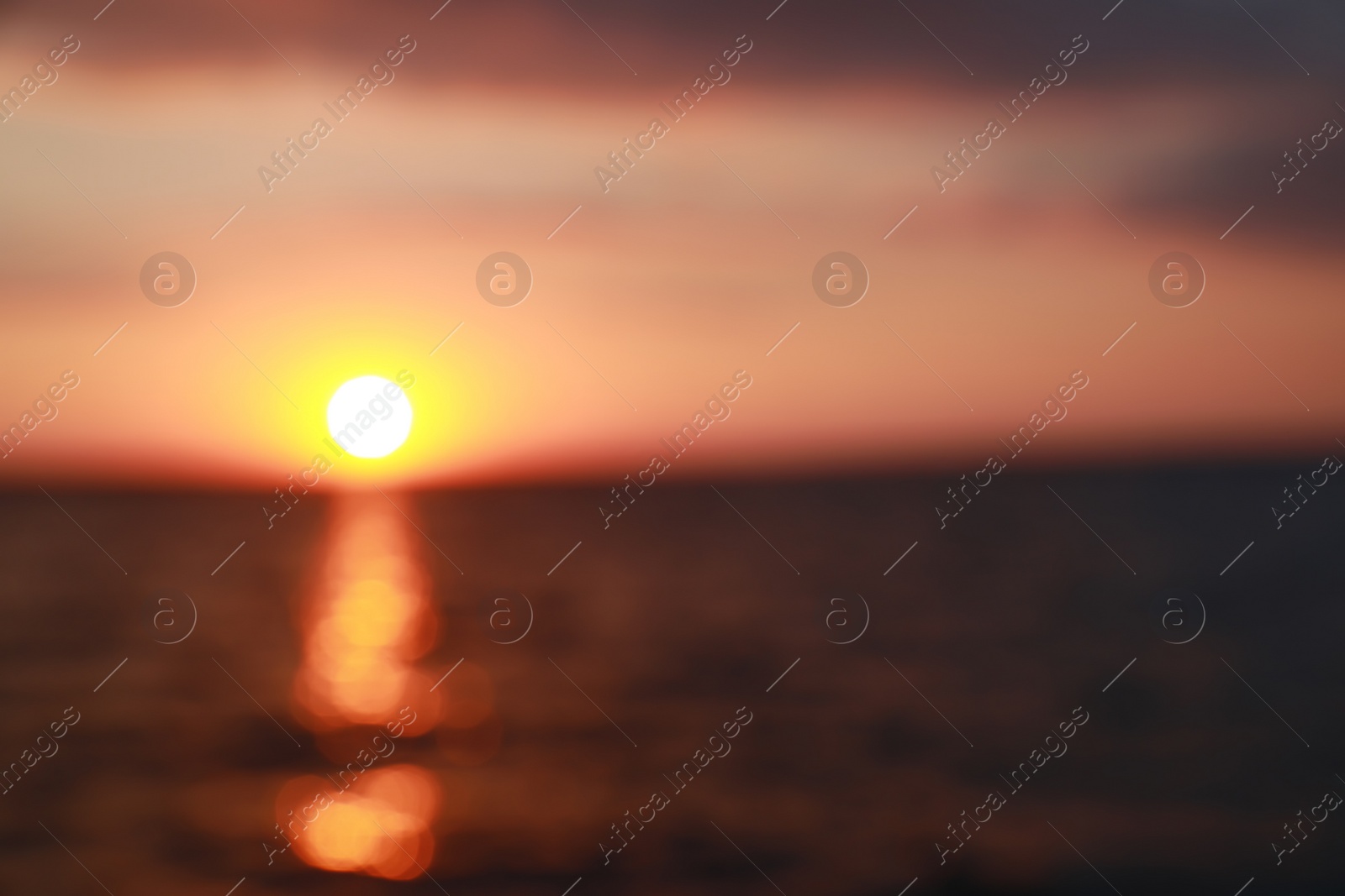 Photo of Blurred view of beautiful sunset on riverside