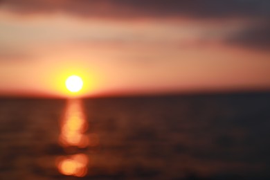 Photo of Blurred view of beautiful sunset on riverside