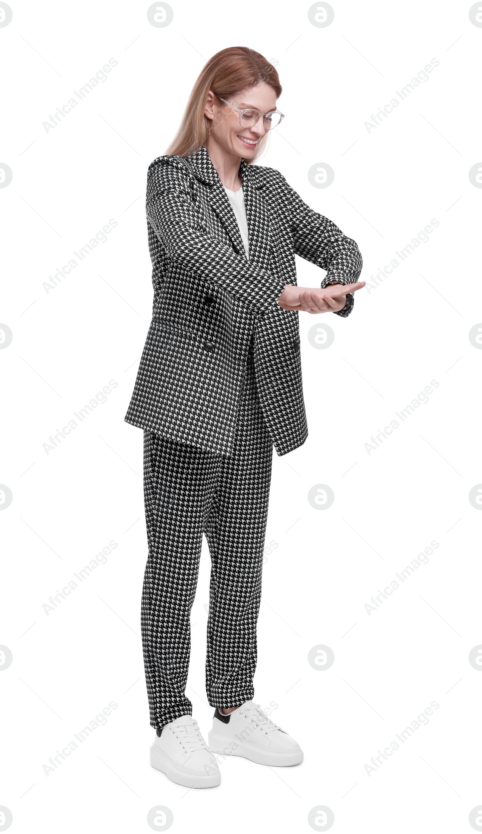 Photo of Beautiful happy businesswoman in suit posing on white background