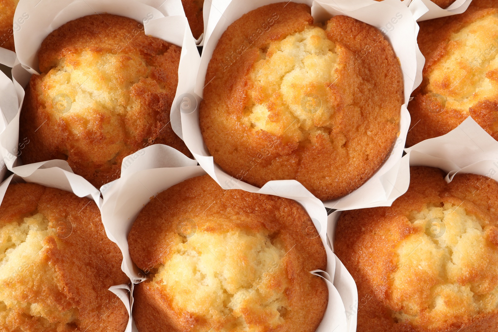 Photo of Tasty muffins as background, top view. Fresh pastry