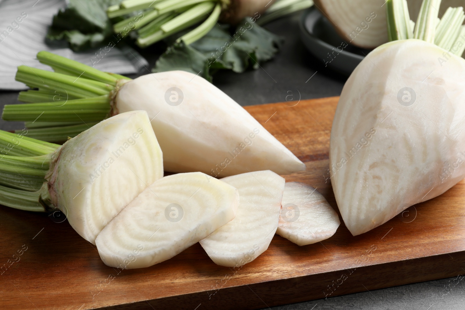 Photo of Peeled and cut sugar beets on wooden board