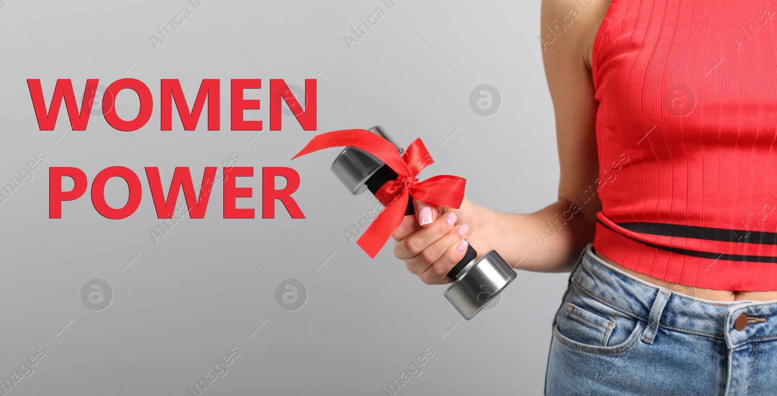 Image of 8 March greeting card. Phrase Women Power and young girl holding dumbbell on light background, closeup