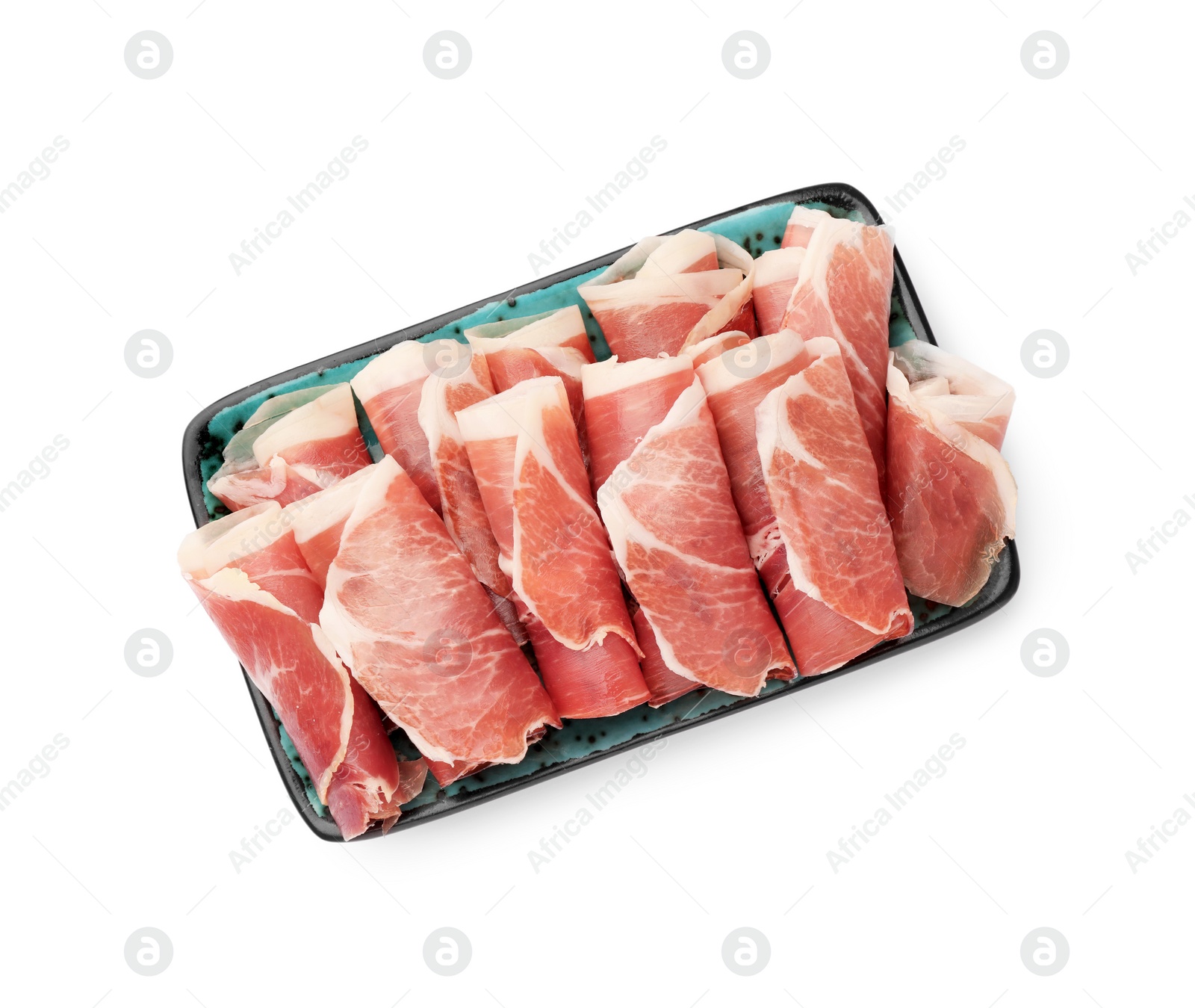 Photo of Plate with rolled slices of delicious jamon isolated on white, top view