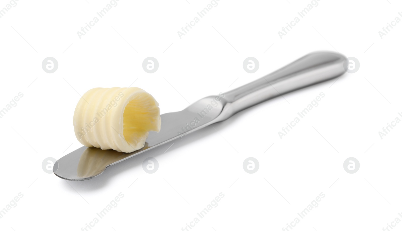 Photo of Butter curl on knife isolated on white