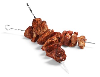 Photo of Metal skewers with delicious shish kebabs isolated on white