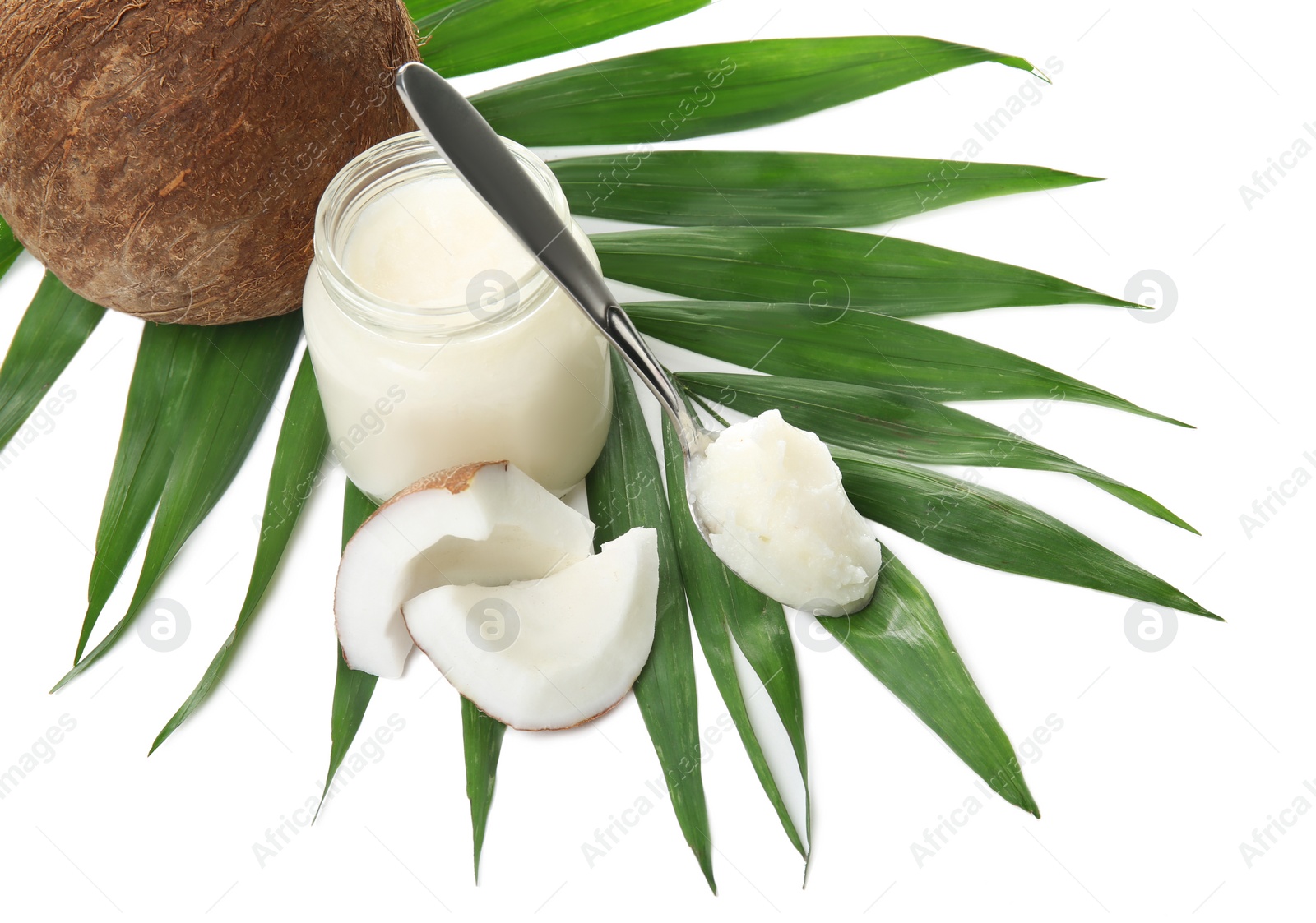 Photo of Beautiful composition with coconut oil and nuts on white background