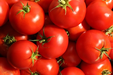 Photo of Fresh ripe red tomatoes as background, closeup