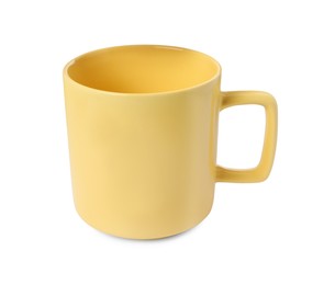 Photo of One yellow ceramic mug isolated on white