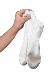 Photo of Woman holding dirty socks on white background, closeup