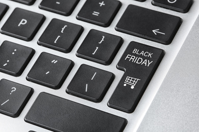 Image of Laptop keyboard with Black Friday button, closeup. Online shopping 
