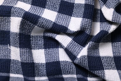 Texture of crumpled checkered fabric as background, top view