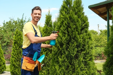 Photo of Man working in garden on sunny day