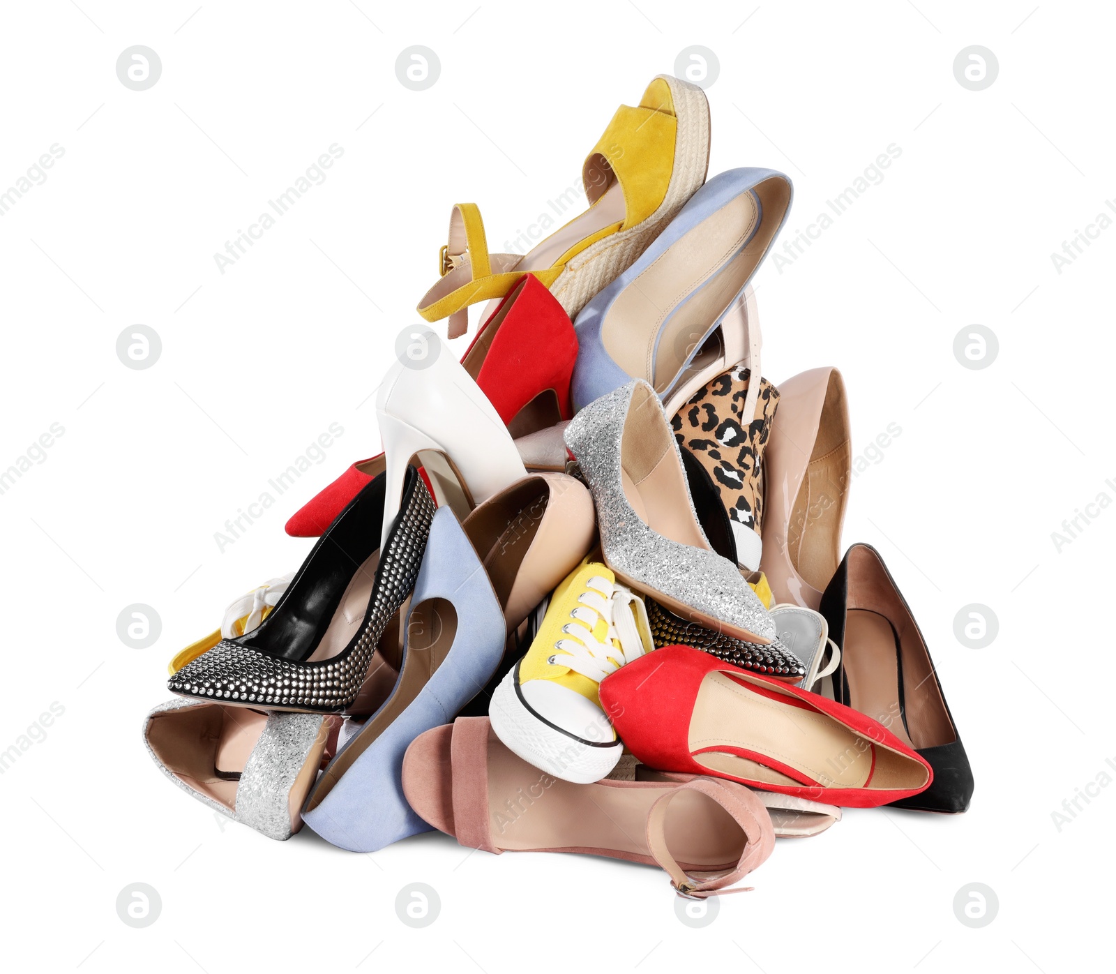 Photo of Pile of different female shoes isolated on white