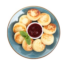 Photo of Delicious cottage cheese pancakes with jam and mint isolated on white, top view