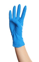 Photo of Woman in blue latex gloves showing four fingers on white background, closeup of hand