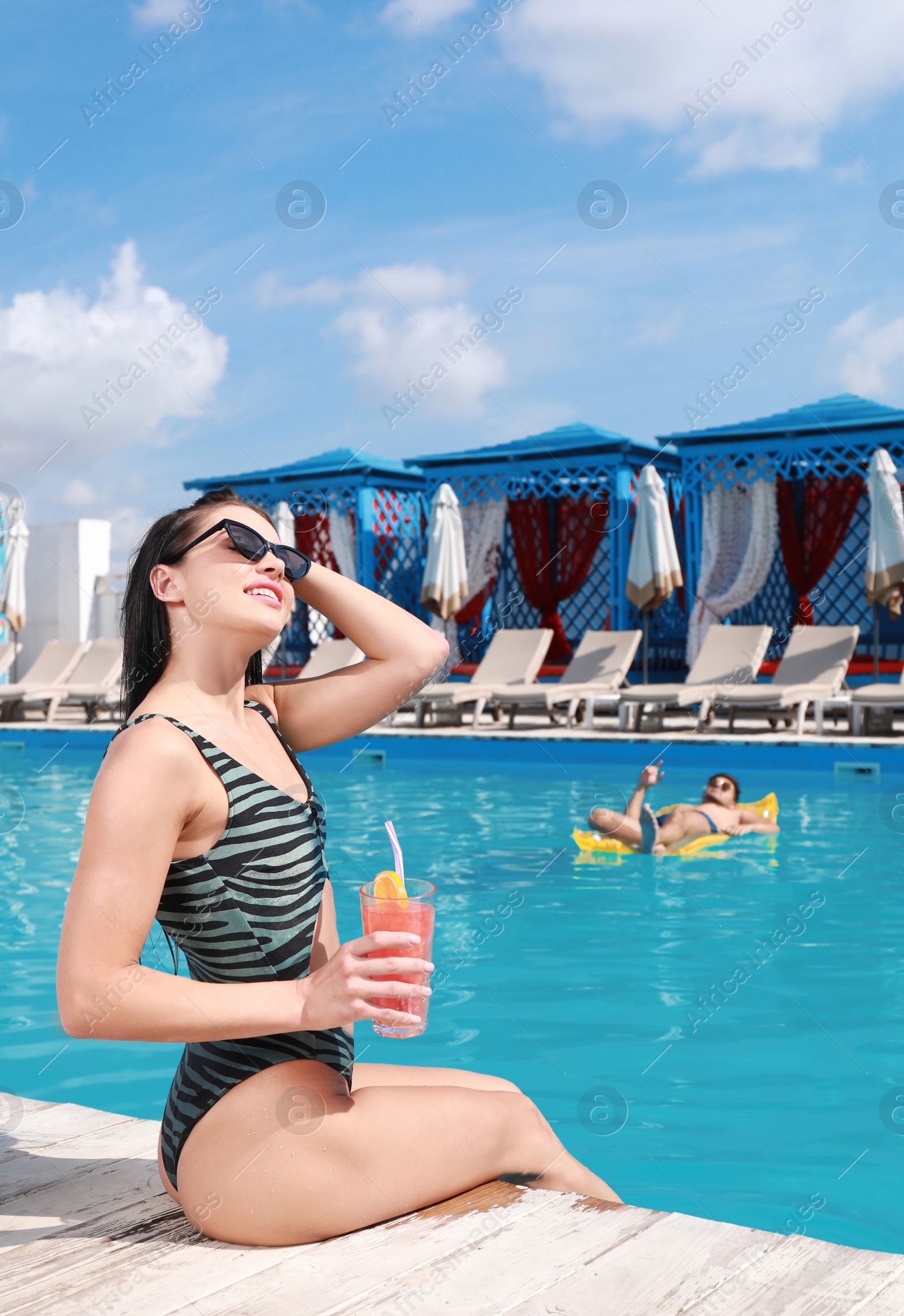 Photo of Happy young couple at resort on sunny day