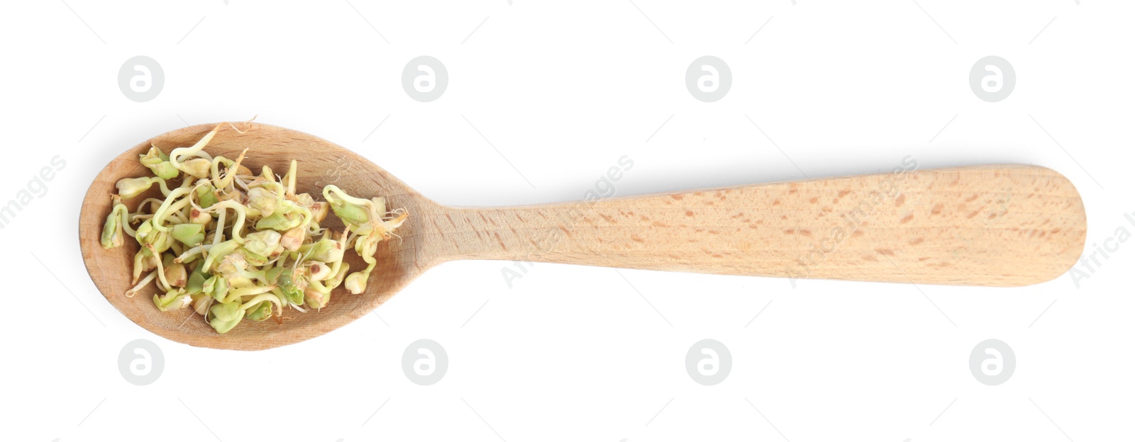 Photo of Wooden spoon of sprouted green buckwheat isolated on white, top view