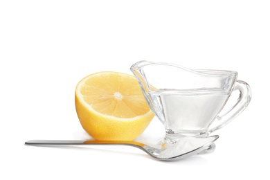 Photo of Composition with vinegar, lemon and baking soda on white background
