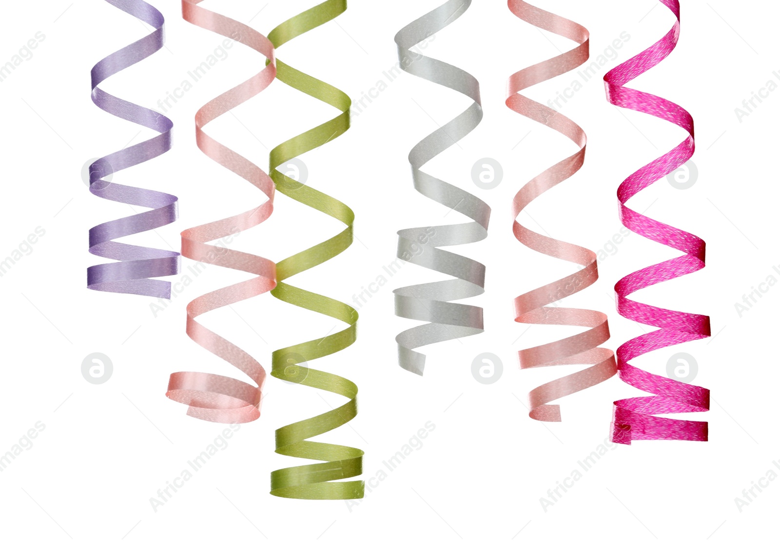 Photo of Many colorful serpentine streamers on white background