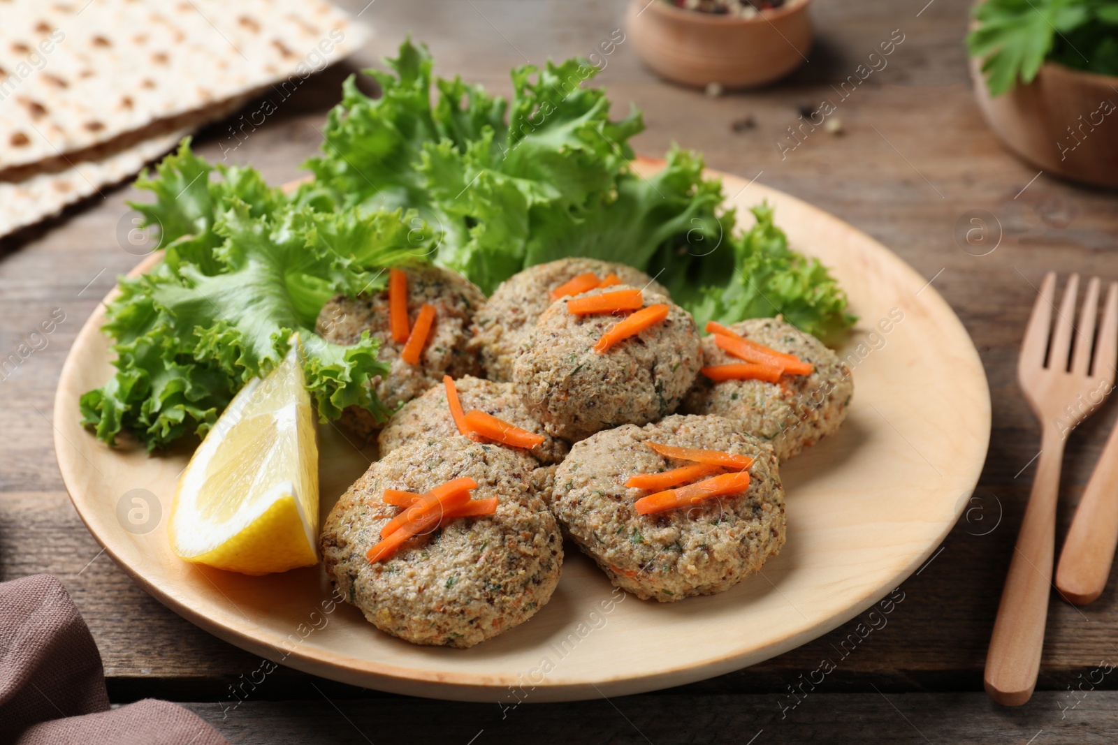 Photo of Plate of traditional Passover (Pesach) gefilte fish on wooden table