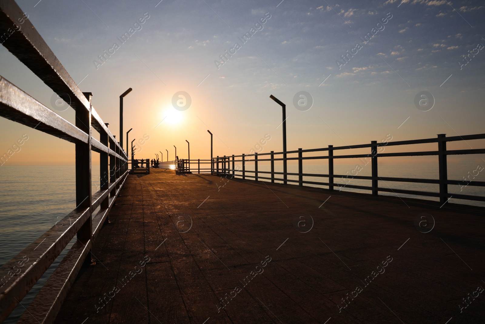 Photo of Picturesque view of empty pier at sunrise