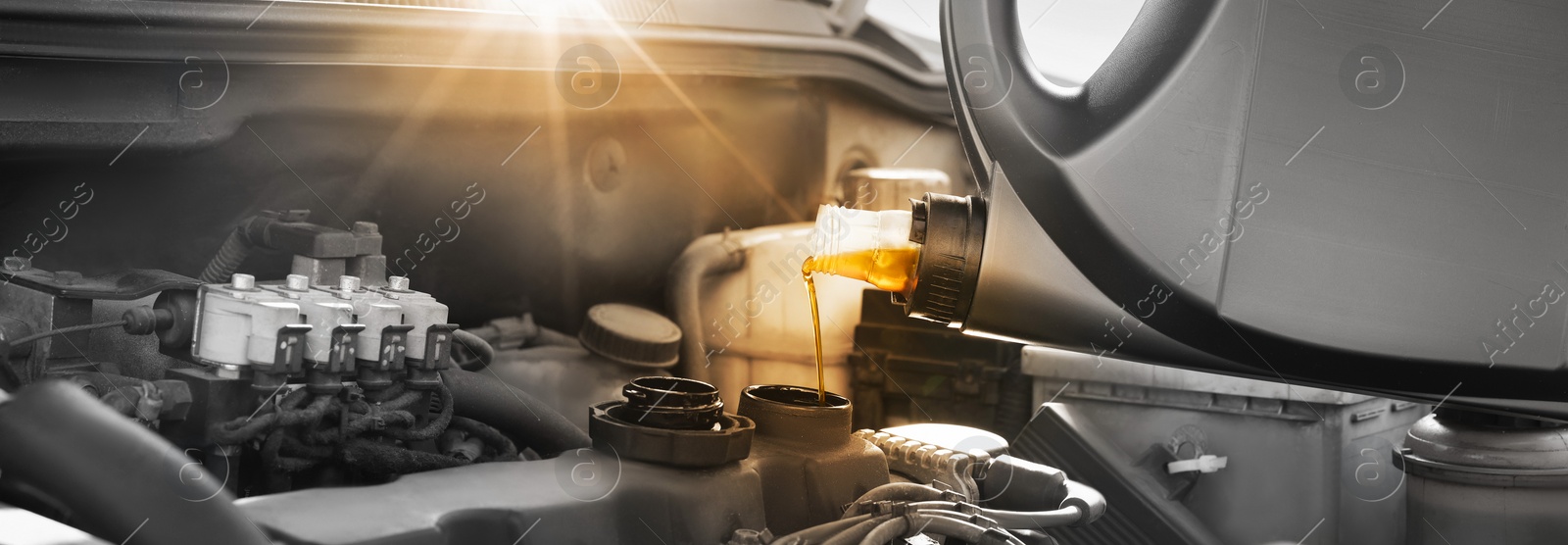 Image of Pouring motor oil into car engine, color accent effect. Banner design