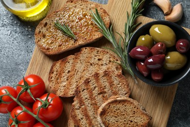 Flat lay composition with bruschettas on grey table