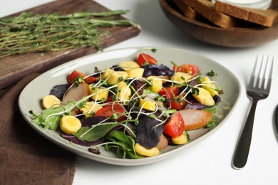 Photo of Delicious fresh carrot salad served on white table, closeup