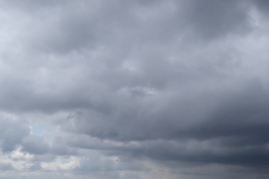 Sky with heavy rainy clouds on grey day