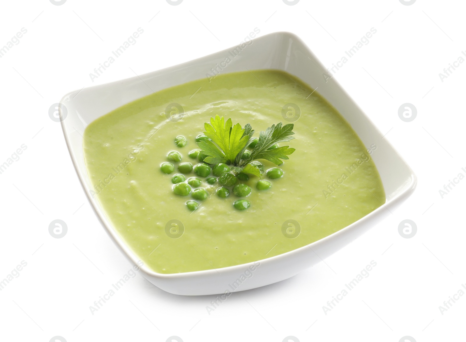 Photo of Fresh vegetable detox soup made of green peas in dish on white background