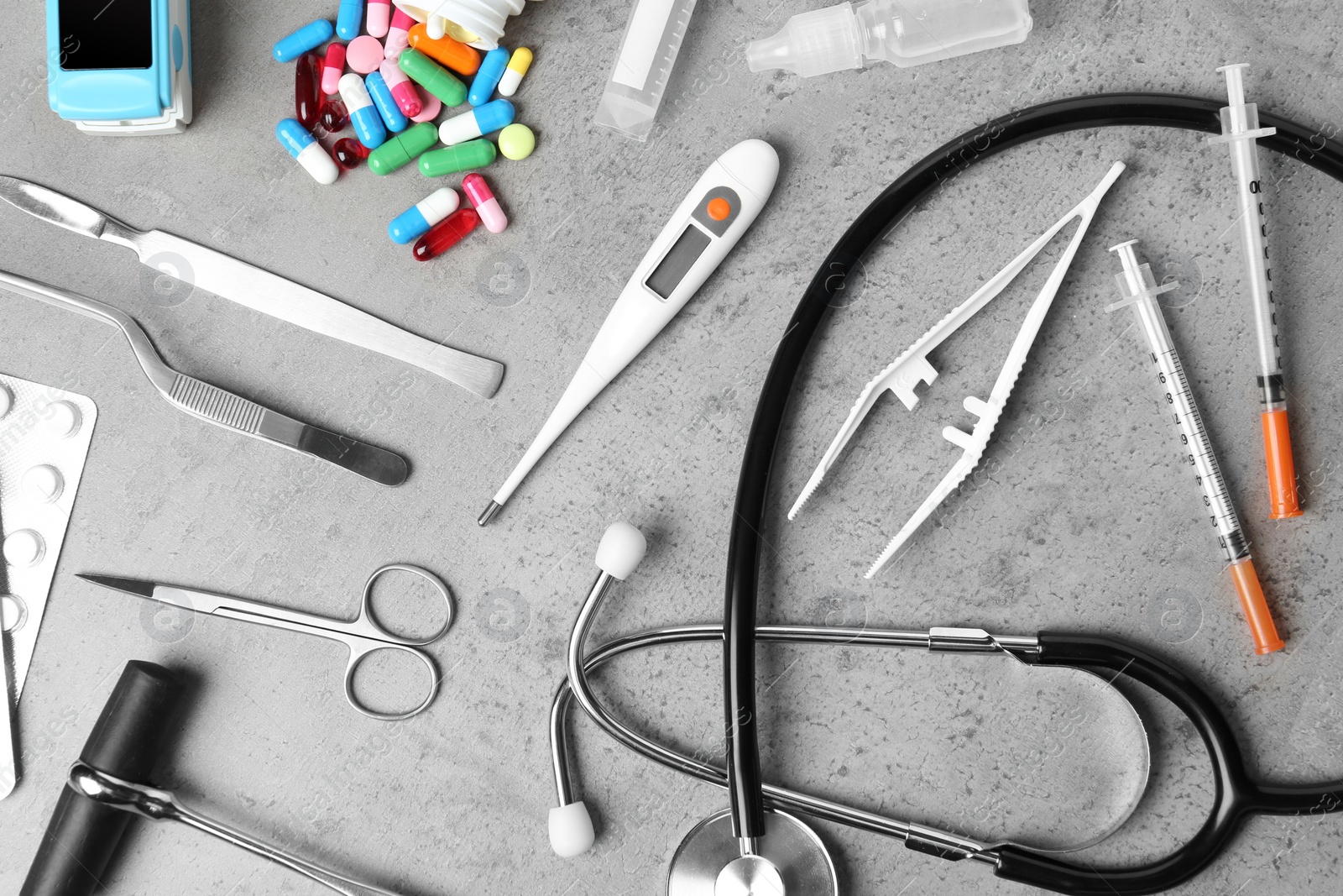 Photo of Flat lay composition with different medical objects on grey background