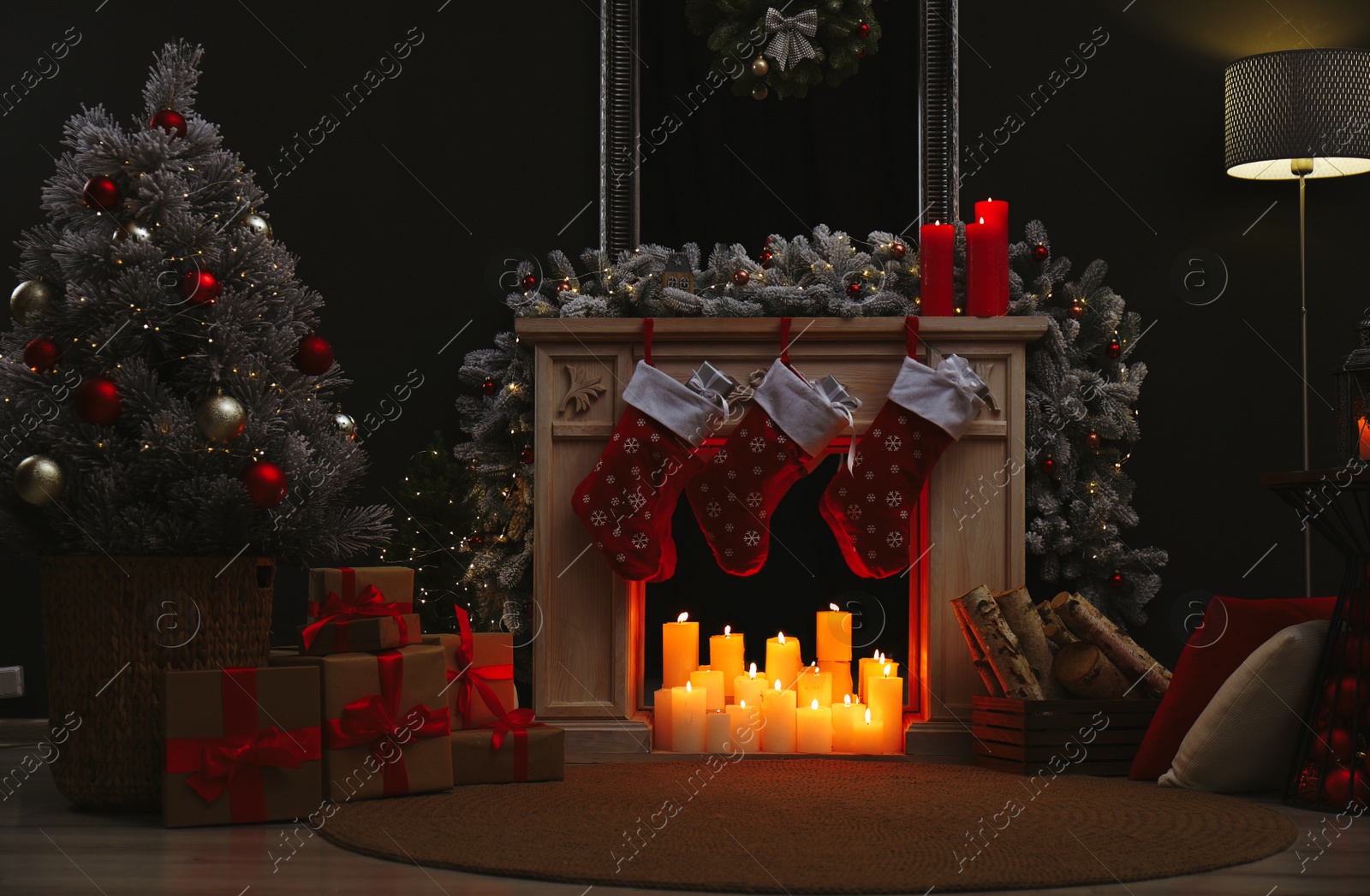 Photo of Fireplace with Christmas stockings in festive room interior