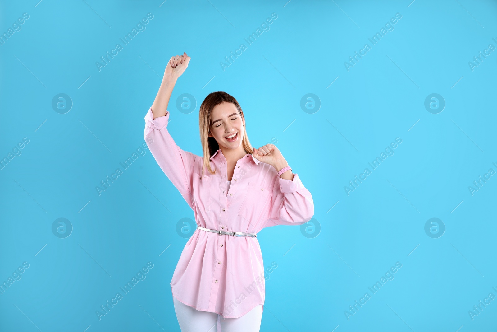 Photo of Portrait of emotional teenage girl on color background