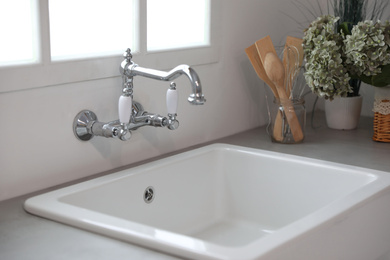 Photo of Kitchen counter with new ceramic sink and tap