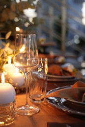 Photo of Elegant table setting with beautiful decor and burning candles indoors