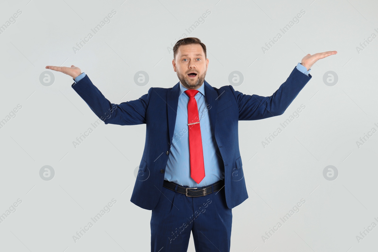 Photo of Portrait of emotional mature man on light grey background